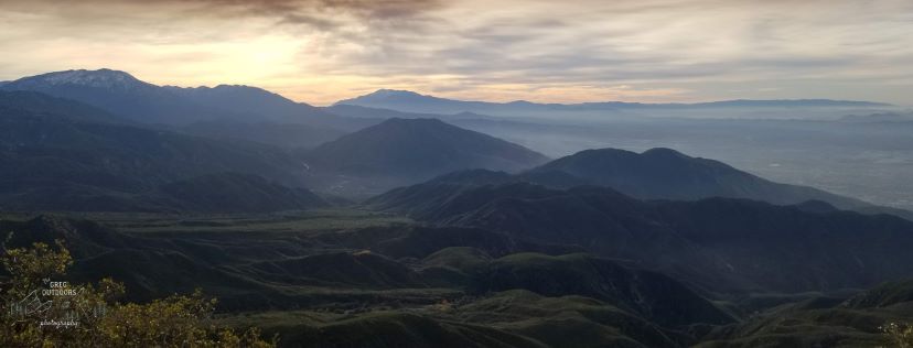 sunset over rolling hills